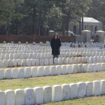 CIMG3929 Amy Walvoord standing behind Samuel Davidson's marker at Andersonville National Cemetery.